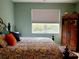 Spacious bedroom with a queen-size bed and large window at 1649 Linz Ct, Winter Haven, FL 33884