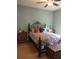 Bedroom with light teal walls and a metal bed frame at 1649 Linz Ct, Winter Haven, FL 33884