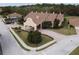 Community building with arched entryway and brown tile roof at 1649 Linz Ct, Winter Haven, FL 33884