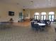 Community room with tables, chairs, and dance floor at 1649 Linz Ct, Winter Haven, FL 33884