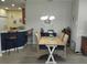 Dining area with kitchen views and a farmhouse-style table at 1649 Linz Ct, Winter Haven, FL 33884