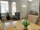 Dining area with wooden table, wicker chairs, and entryway view at 1649 Linz Ct, Winter Haven, FL 33884