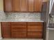 Well-equipped kitchen with ample cabinetry and granite countertops at 1649 Linz Ct, Winter Haven, FL 33884