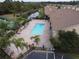 Community pool with spa and surrounding patio area at 1649 Linz Ct, Winter Haven, FL 33884