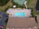 Community pool and spa with surrounding patio and lounge chairs at 1649 Linz Ct, Winter Haven, FL 33884