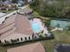 Community pool and tennis court with lush landscaping at 1649 Linz Ct, Winter Haven, FL 33884