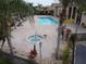 Community pool and spa with a brick patio area at 1649 Linz Ct, Winter Haven, FL 33884