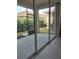 Screened patio with sliding glass doors and view of backyard at 1649 Linz Ct, Winter Haven, FL 33884