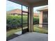 Spacious screened patio with access to backyard at 1649 Linz Ct, Winter Haven, FL 33884