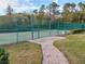 Community tennis court with paved walkway at 1649 Linz Ct, Winter Haven, FL 33884