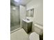 Updated bathroom features a shower with glass door, contemporary vanity, and toilet at 1663 W Lake Cannon Nw Dr, Winter Haven, FL 33881