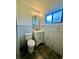 Clean bathroom with white vanity and toilet at 1663 W Lake Cannon Nw Dr, Winter Haven, FL 33881