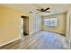 Spacious bedroom with built-in wardrobe and ceiling fan at 1663 W Lake Cannon Nw Dr, Winter Haven, FL 33881
