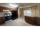 Kitchen with island and black appliances overlooks living room at 1663 W Lake Cannon Nw Dr, Winter Haven, FL 33881