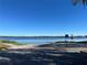 Scenic lake view with boat ramp access on a bright, clear day at 1663 W Lake Cannon Nw Dr, Winter Haven, FL 33881
