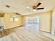 Open and bright living room with light walls and ceiling fans at 1663 W Lake Cannon Nw Dr, Winter Haven, FL 33881