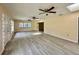 Open living area with vinyl flooring and ceiling fans, offering abundant natural light at 1663 W Lake Cannon Nw Dr, Winter Haven, FL 33881