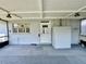 Enclosed porch with tiled floor, ample natural light, and access to backyard offer a versatile space at 1663 W Lake Cannon Nw Dr, Winter Haven, FL 33881