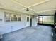 Charming screened-in patio provides an ideal space for outdoor enjoyment, with lighting and backyard access at 1663 W Lake Cannon Nw Dr, Winter Haven, FL 33881