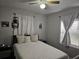 Bedroom with a queen-size bed and ceiling fan at 205 Maple W St, Davenport, FL 33837