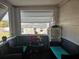 Cozy screened porch with wicker furniture at 205 Maple W St, Davenport, FL 33837