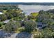 Aerial view of a large home near a lake, showcasing its architecture and setting at 2300 N Scenic Hwy # 37, Lake Wales, FL 33853