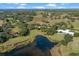 Aerial view of a waterfront property with expansive grounds and a large house at 2300 N Scenic Hwy # 37, Lake Wales, FL 33853