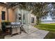 Outdoor patio with grill and steps leading to lake view at 2300 N Scenic Hwy # 37, Lake Wales, FL 33853