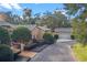 Home exterior showcasing a driveway, garage, and well-maintained landscaping at 2300 N Scenic Hwy # 37, Lake Wales, FL 33853