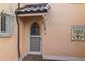 Quaint exterior entrance with arched door and tile accents at 2300 N Scenic Hwy # 37, Lake Wales, FL 33853