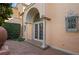 Elegant entry with arched doorway, columns, and brick pavers at 2300 N Scenic Hwy # 37, Lake Wales, FL 33853