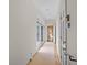 Long hallway with neutral walls and access to other rooms at 2300 N Scenic Hwy # 37, Lake Wales, FL 33853