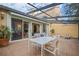 Outdoor patio with seating area and view of house interior at 2300 N Scenic Hwy # 37, Lake Wales, FL 33853