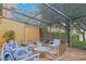 Spacious screened porch with comfortable seating and tranquil view at 2300 N Scenic Hwy # 37, Lake Wales, FL 33853