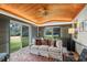 Relaxing sunroom with wood ceiling and access to the backyard at 2300 N Scenic Hwy # 37, Lake Wales, FL 33853