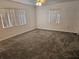 Bedroom with neutral carpeting and two windows at 2314 York Pl, Lakeland, FL 33810
