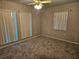 Spacious bedroom with neutral carpeting and ceiling fan at 2314 York Pl, Lakeland, FL 33810