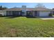 Ranch-style home with a large yard and attached garage at 2314 York Pl, Lakeland, FL 33810