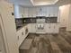 Newly renovated kitchen, white shaker cabinets, granite countertops at 2314 York Pl, Lakeland, FL 33810