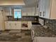 Updated kitchen, white cabinets, granite countertops, and stainless steel appliances at 2314 York Pl, Lakeland, FL 33810