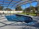 Enclosed pool area with patio and fenced yard at 2314 York Pl, Lakeland, FL 33810