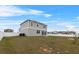 Two story house with backyard, solar panels, and fence at 245 Hillcrest Dr, Dundee, FL 33838