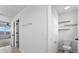 Small half bathroom with toilet and shelving at 245 Hillcrest Dr, Dundee, FL 33838