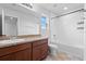 Bathroom with tub, single vanity, and tile flooring at 245 Hillcrest Dr, Dundee, FL 33838