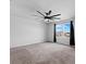 Spacious bedroom with ceiling fan and carpet flooring at 245 Hillcrest Dr, Dundee, FL 33838