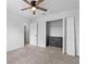 Bedroom with ceiling fan and built-in dresser at 245 Hillcrest Dr, Dundee, FL 33838