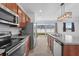 Kitchen with stainless steel appliances and wood cabinets at 245 Hillcrest Dr, Dundee, FL 33838