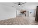 Open floor plan living room and kitchen with tile floors at 245 Hillcrest Dr, Dundee, FL 33838