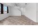 Spacious living room with tile flooring and ceiling fan at 245 Hillcrest Dr, Dundee, FL 33838