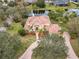 Luxury home with tile roof, circular driveway and landscaping at 2683 Wyndsor Oaks Way, Winter Haven, FL 33884